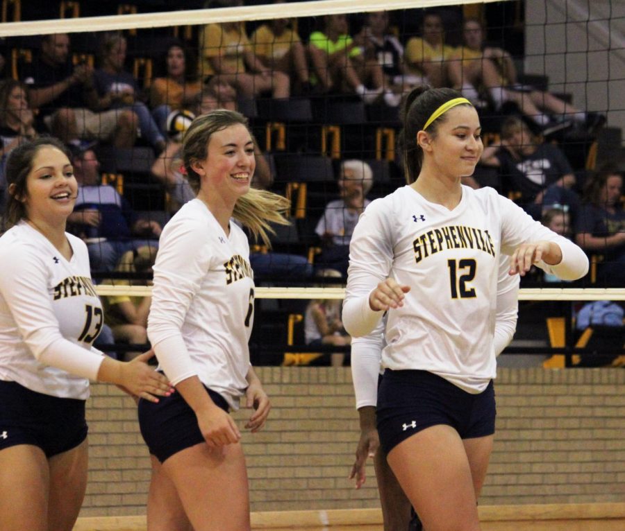 From L to R: Destiny Hale, Hannah Huckabee, and Jayci Morton. 
Senior Bees celebrate after getting a kill in an away game during the 2018 fall season.
