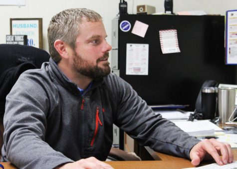 Starting the day, Vice Principal Hamilton looks over his agenda as he prepares for his school duties. 