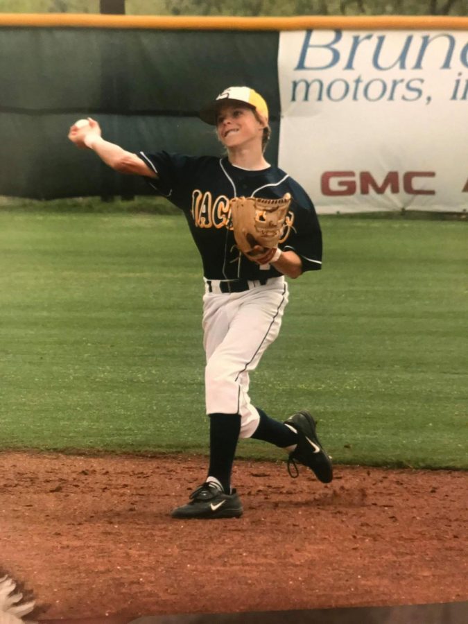 Brock Holt playing for the Stephenville Yellowjackets makes a throw across the baseball diamond while playing the infield.