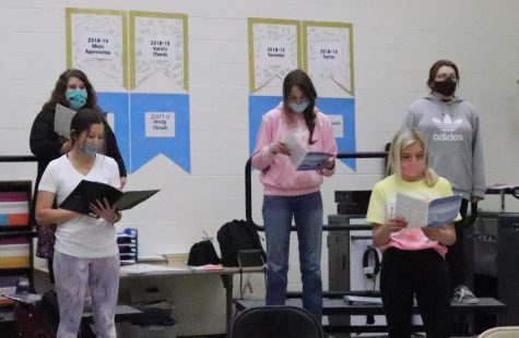 Choir students attend class and practice while wearing masks and staying six feet apart in the 2021 school year.