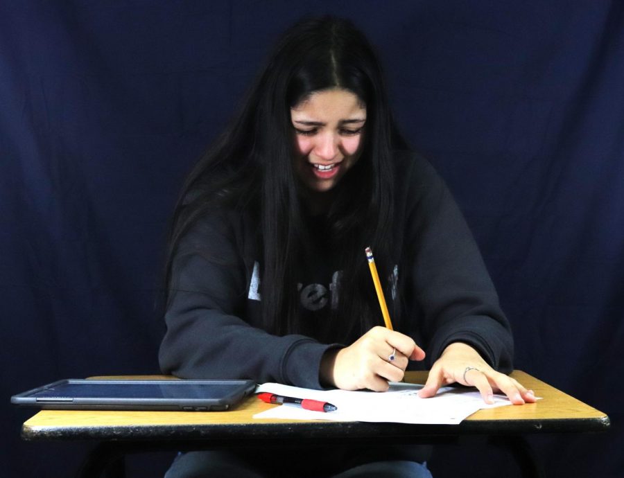 Olivia Mendoza works on 2021 school assignments from home as she struggles to understand what she needs to do to complete the lesson.