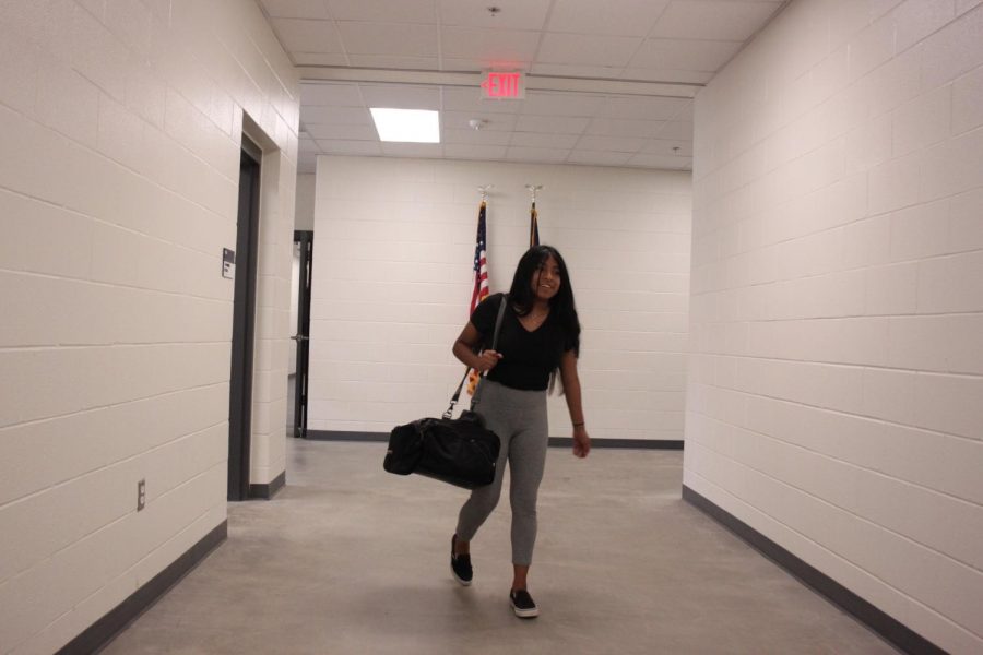 Trainer Cinthia Ruiz heads out to a game to help the players with injuries.