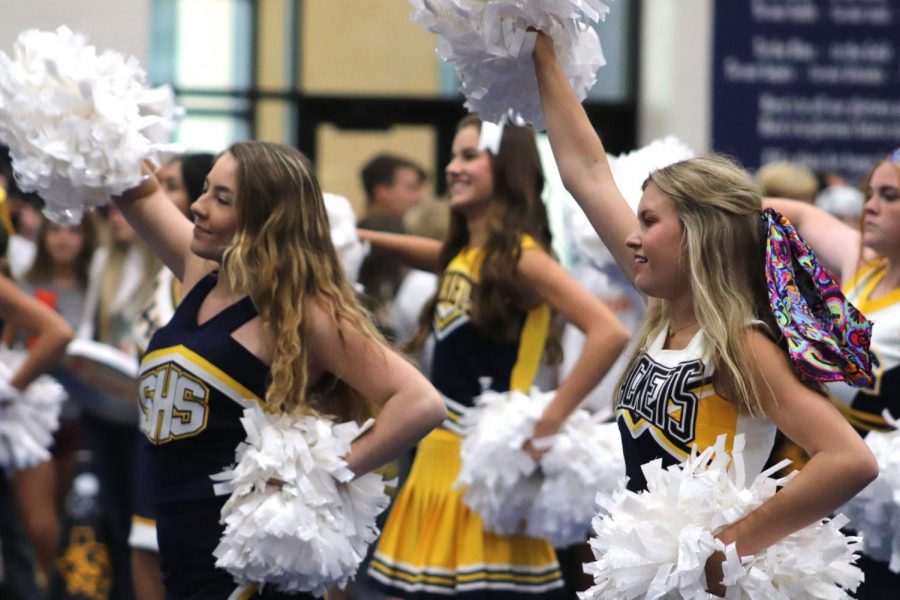 Cheerleaders excite the crowd during the pep rally