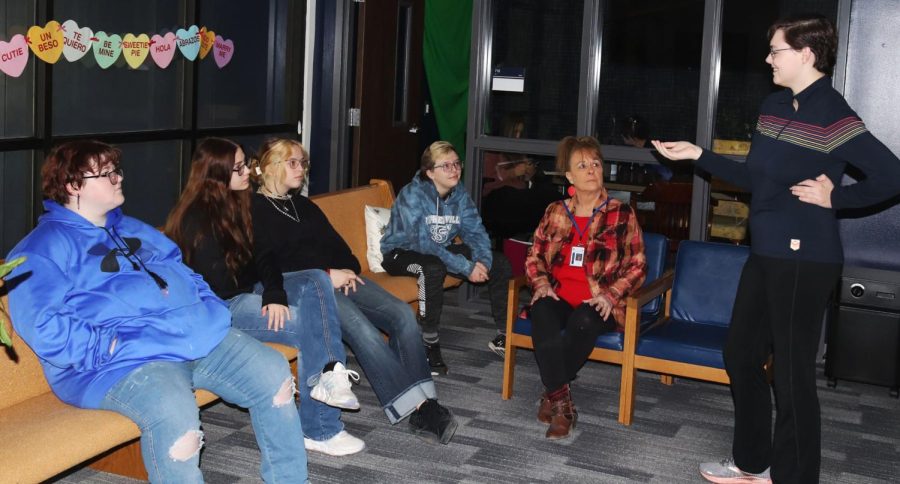 GSA members meet in the library during the school day to plan the agenda for the next meeting.