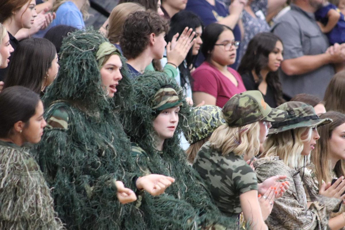 STUDENTS CAMOFLAUGE THIER PRESENCE AT THE PEP RALLY.