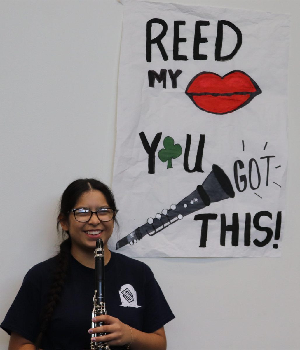 Junior Cielo Puerta demonstrates how to play the clarinet.