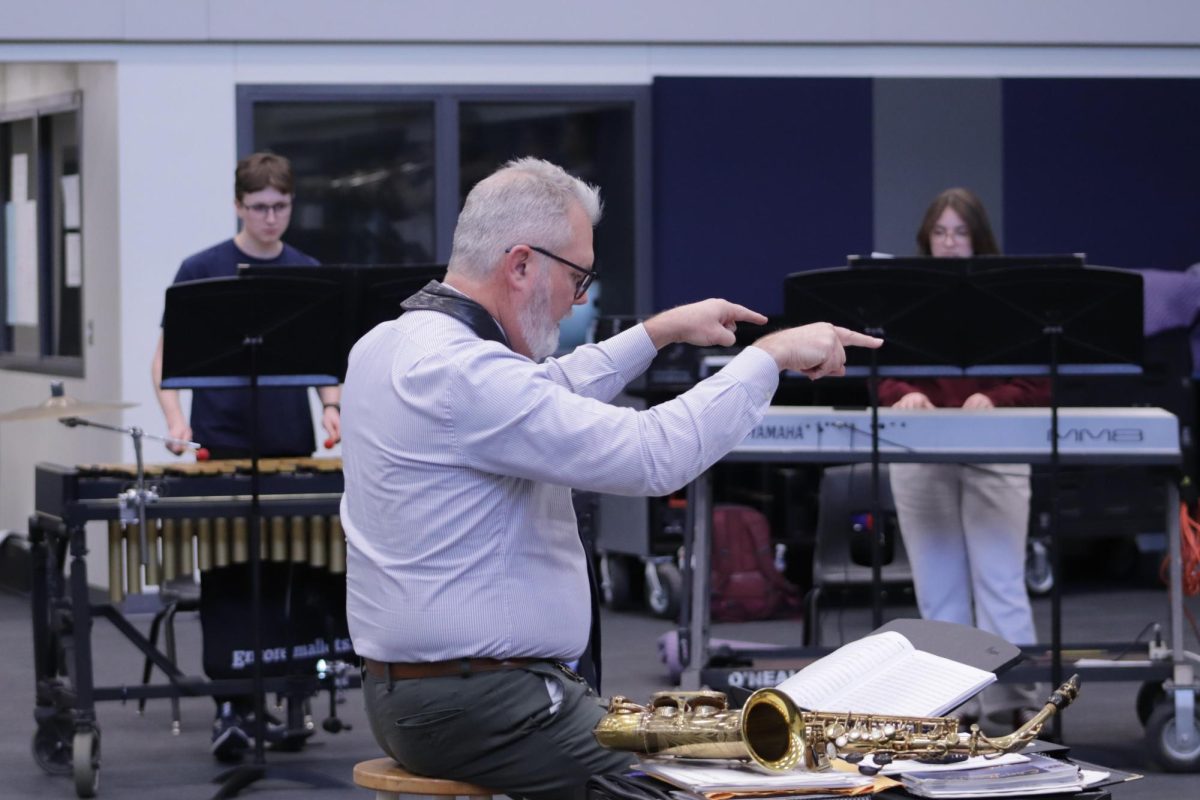 Band Director Michael Childs directs a music session during Jazz Lunch in which parents, students, and faculty are invited to come listen and enjoy.