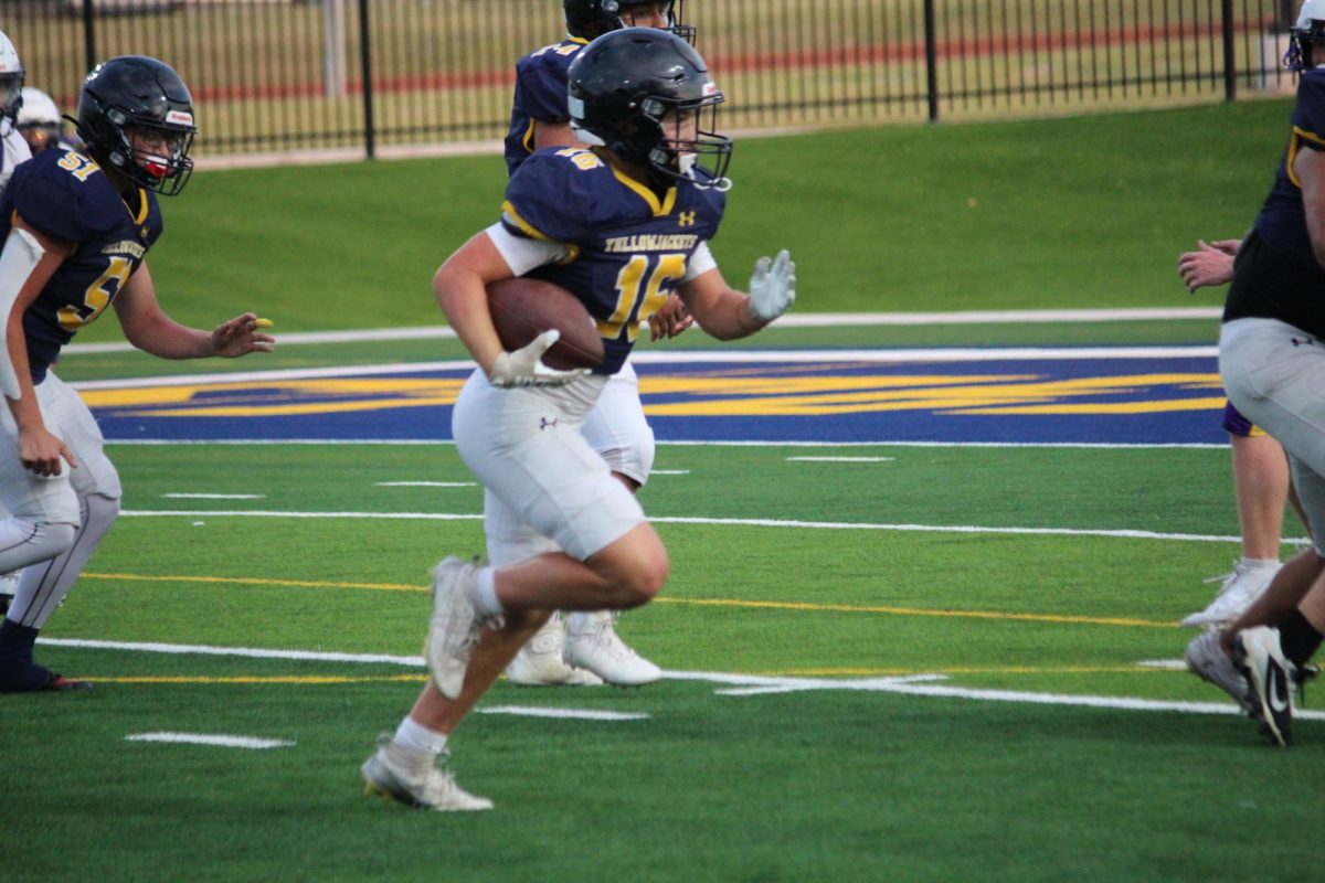 Rowdy Hayes runs for a first down.